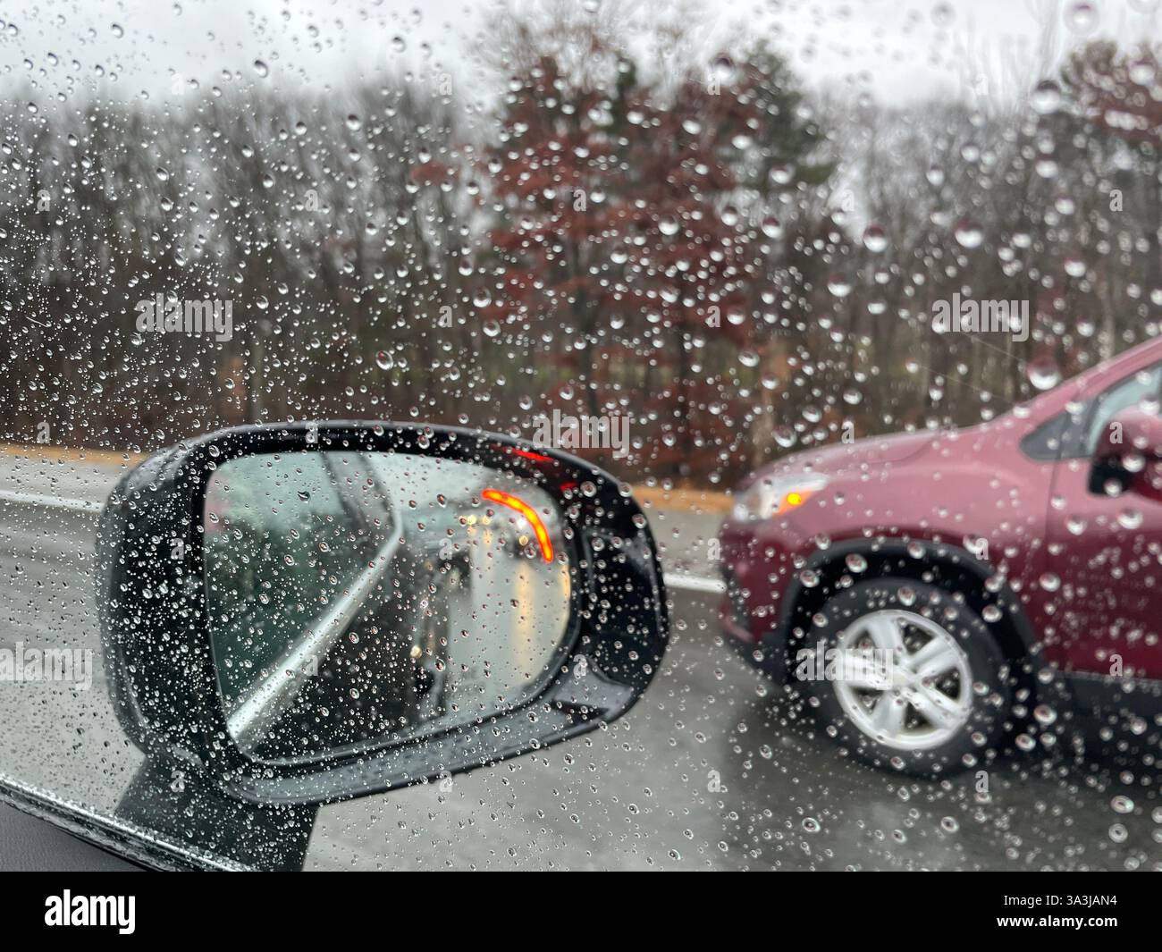 Power side view mirrors afford the driver access to blind spots while driving, 2024, Massachusetts, United States - Smartphone Captured Stock Image
