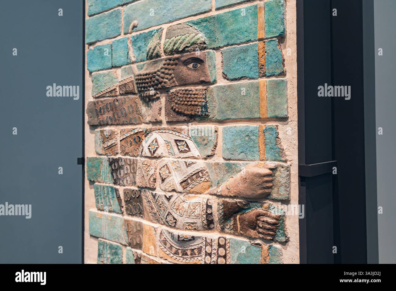17 January 2025, Louvre museum Abu Dhabi, UAE: Glazed brick relief depicting an Assyrian archer from the 8th century BC showcased in a museum Stock Photo
