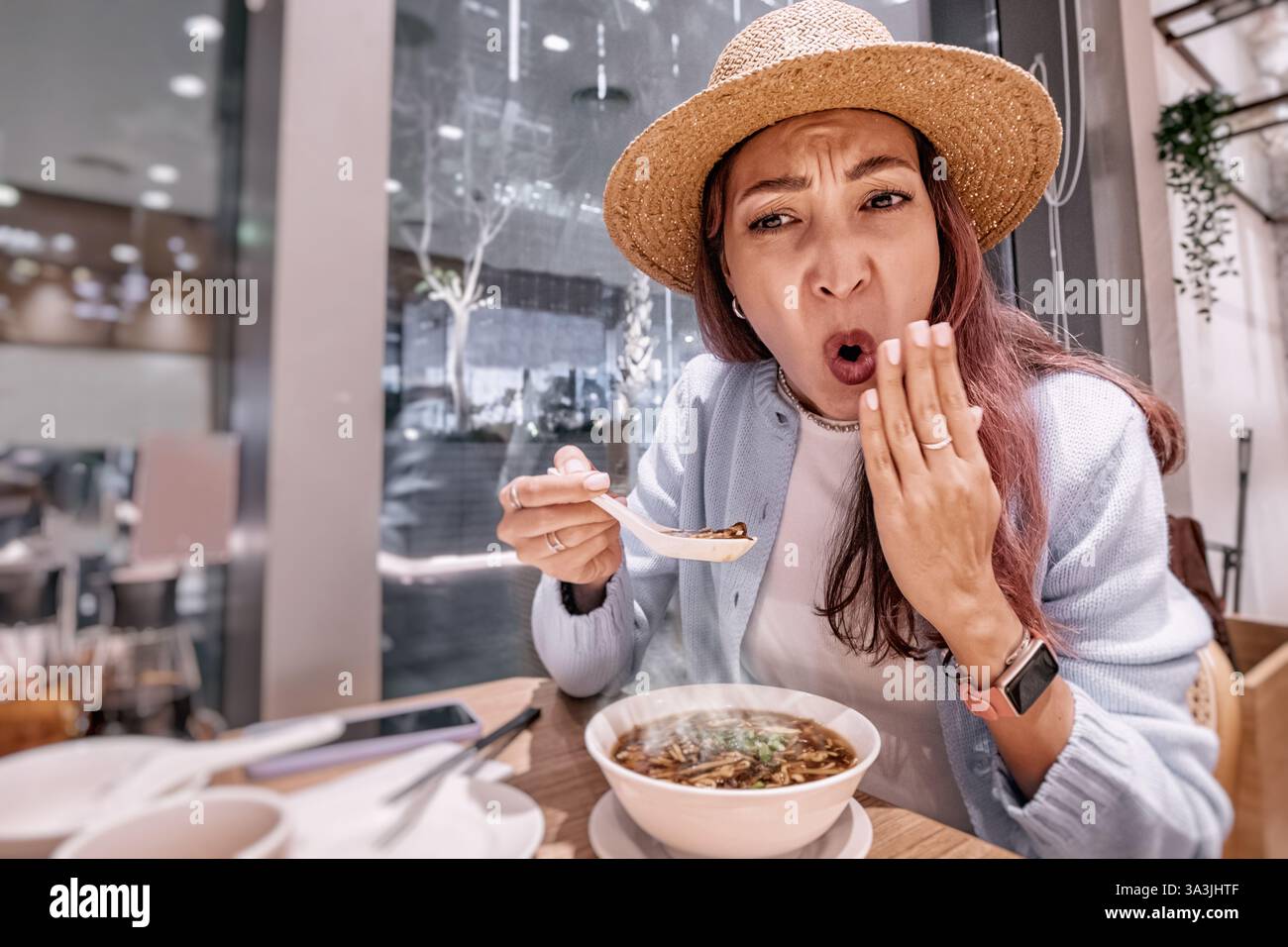 Tourist enjoying traditional food in a chinese restaurant, surpris…