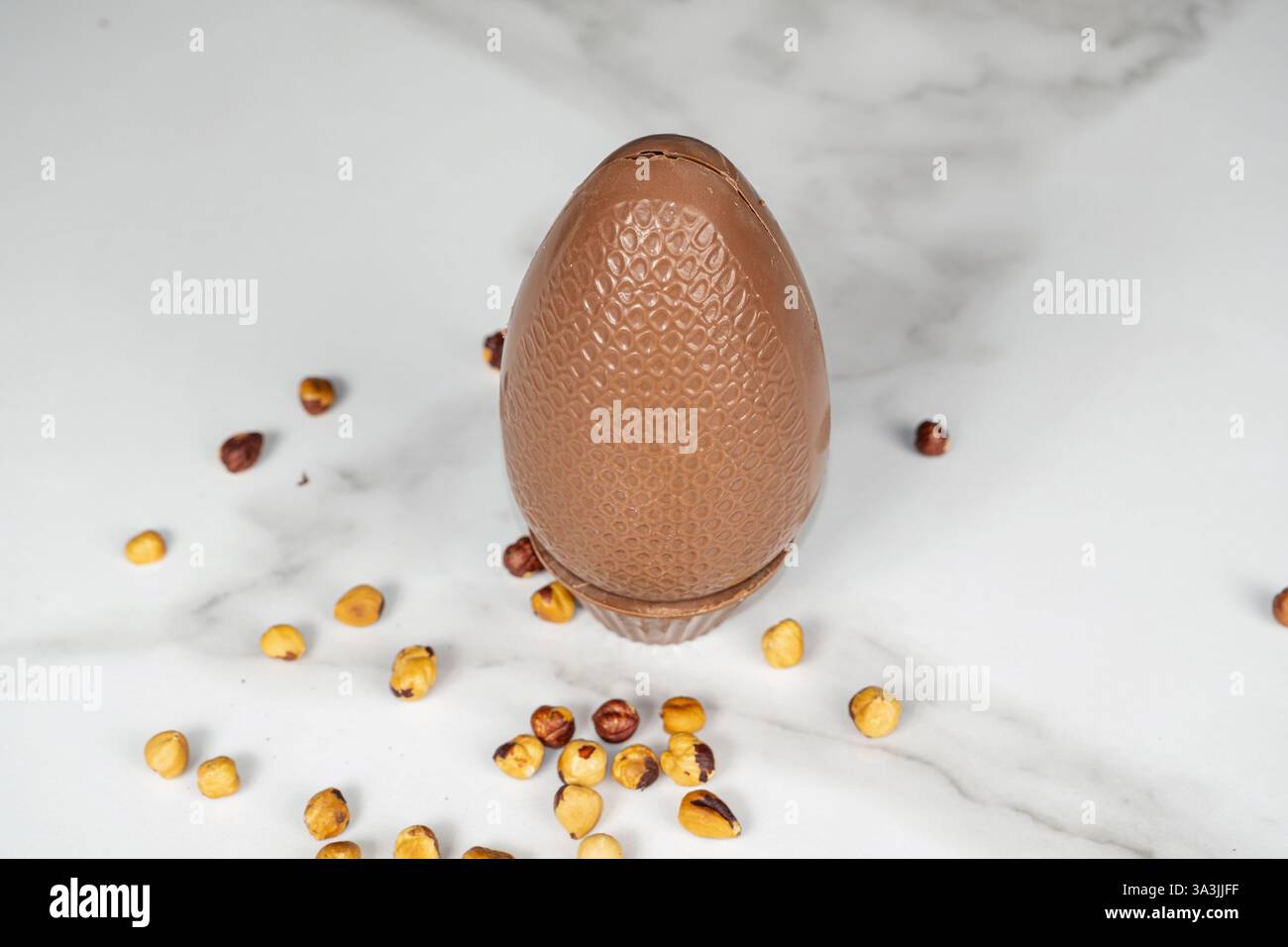 Milk chocolate Easter egg filled with hazelnut cream_top view. Stock Photo