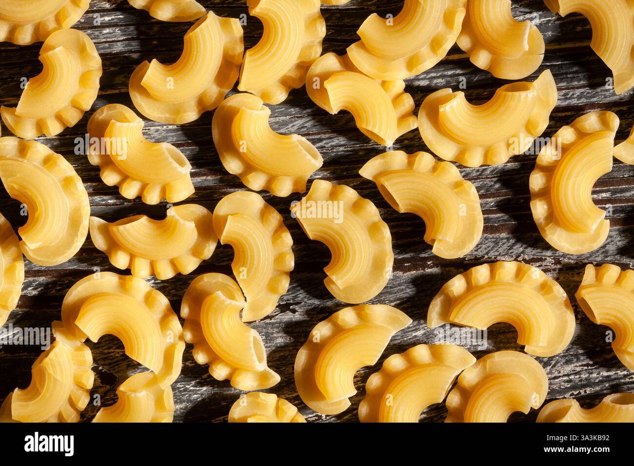 pasta creste on black wood background Stock Photo