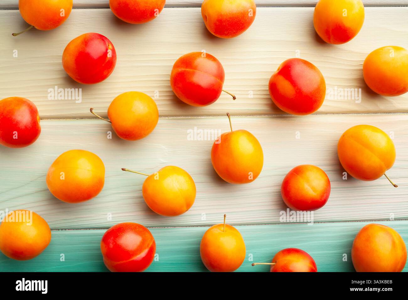 plum on blue wood background top view Stock Photo