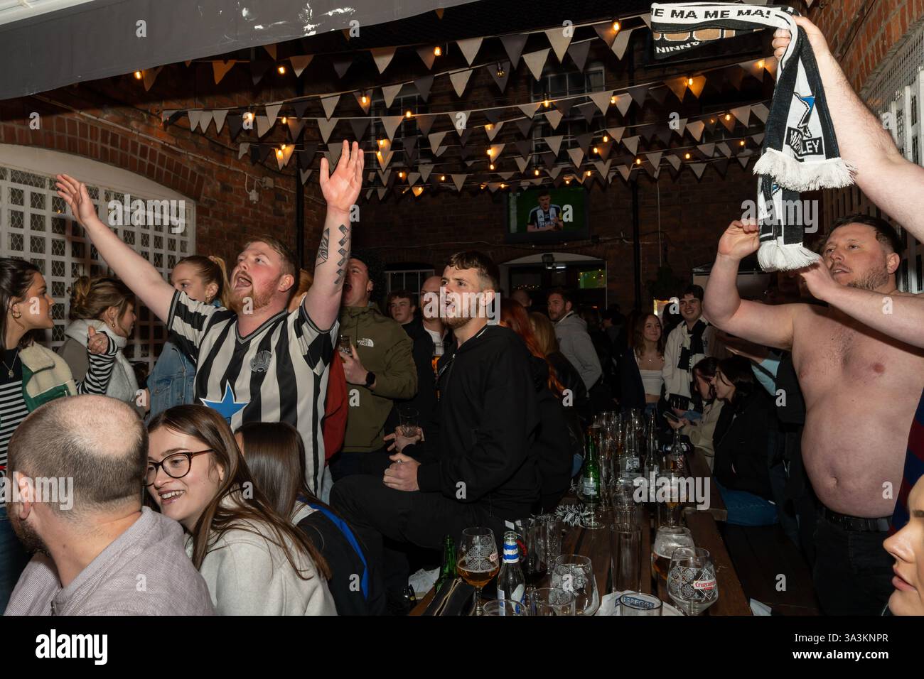 Newcastle upon Tyne, UK. 16th March 2025. Newcastle United fans in the streets. Carabao Cup Final: Newcastle 2 - Liverpool 1. -- Fans outside the Old George pub near the Bigg Market in the city centre.   Credit: Hazel Plater/Alamy Live News Stock Photo