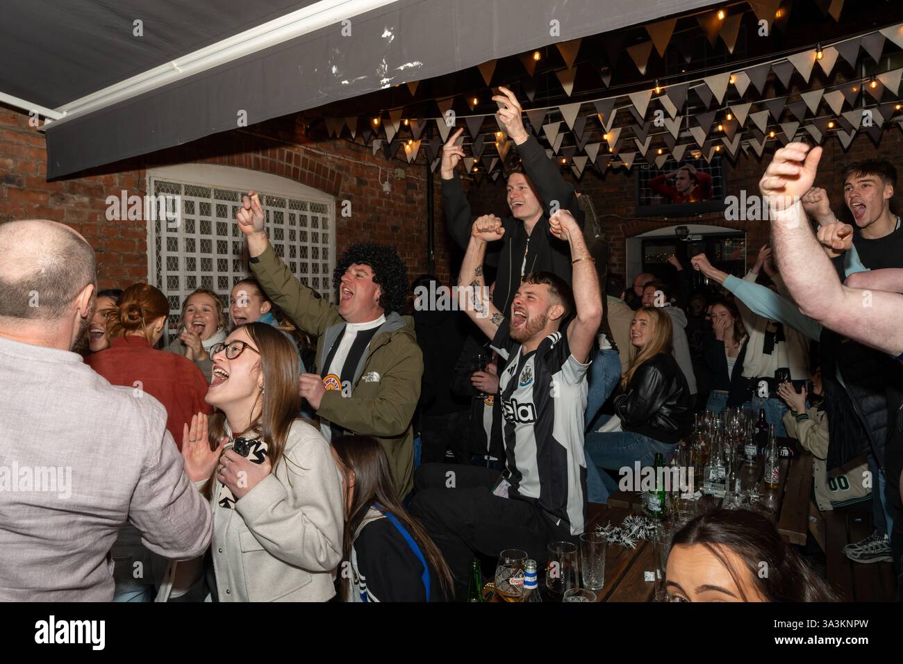 Newcastle upon Tyne, UK. 16th March 2025. Newcastle United fans in the streets. Carabao Cup Final: Newcastle 2 - Liverpool 1. -- Fans outside the Old George pub near the Bigg Market in the city centre.   Credit: Hazel Plater/Alamy Live News Stock Photo