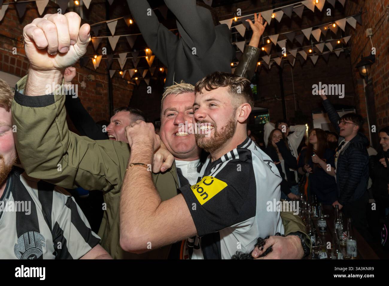 Newcastle upon Tyne, UK. 16th March 2025. Newcastle United fans in the streets. Carabao Cup Final: Newcastle 2 - Liverpool 1. -- Fans outside the Old George pub near the Bigg Market in the city centre.   Credit: Hazel Plater/Alamy Live News Stock Photo