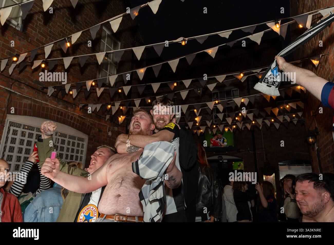 Newcastle upon Tyne, UK. 16th March 2025. Newcastle United fans in the streets. Carabao Cup Final: Newcastle 2 - Liverpool 1. -- Fans outside the Old George pub near the Bigg Market in the city centre.   Credit: Hazel Plater/Alamy Live News Stock Photo
