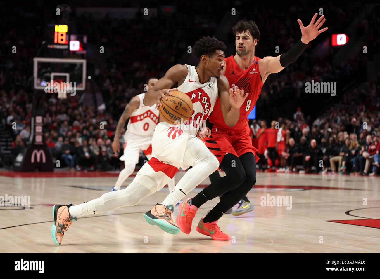Toronto Raptors guard Ochai Agbaji (30) drives to the basket as ...