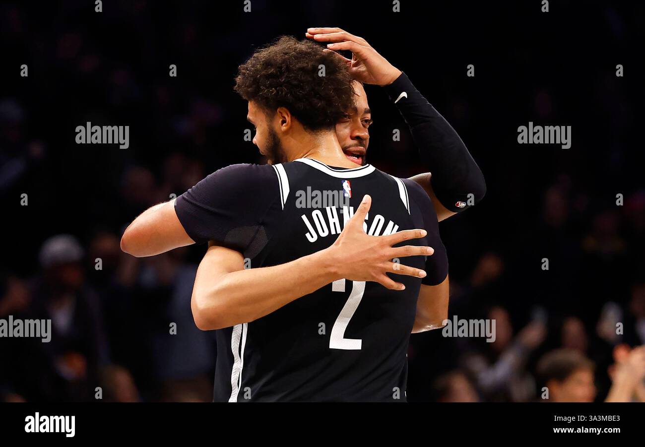 Brooklyn Nets forwards Cameron Johnson (2) and Trendon Watford (9 ...