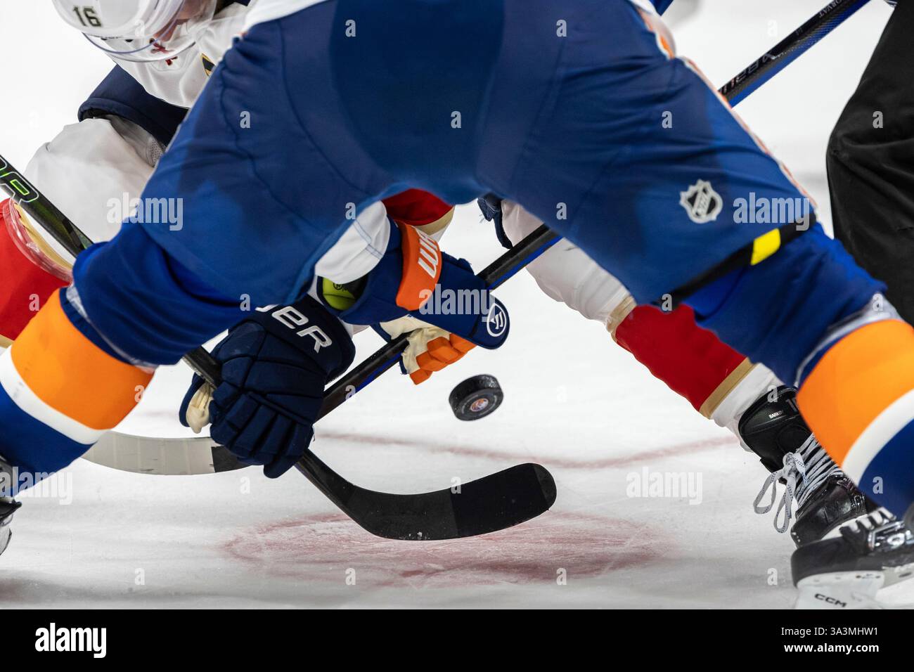 The puck drops for a face off between the New York Islanders and the ...