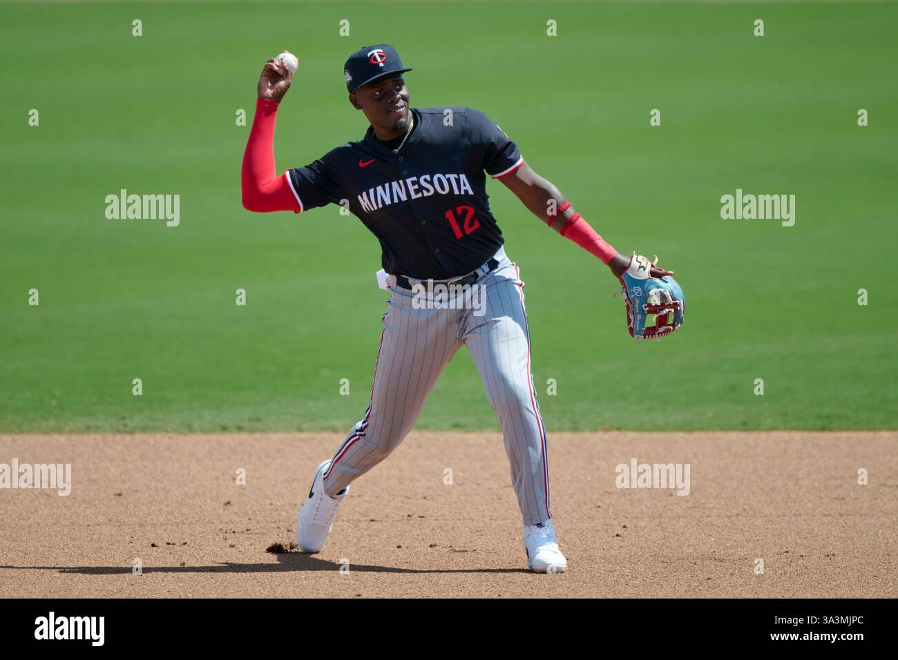 Raynes Third Line Minnesota Twins third baseman Rayne Doncon (12) throws to first base ...