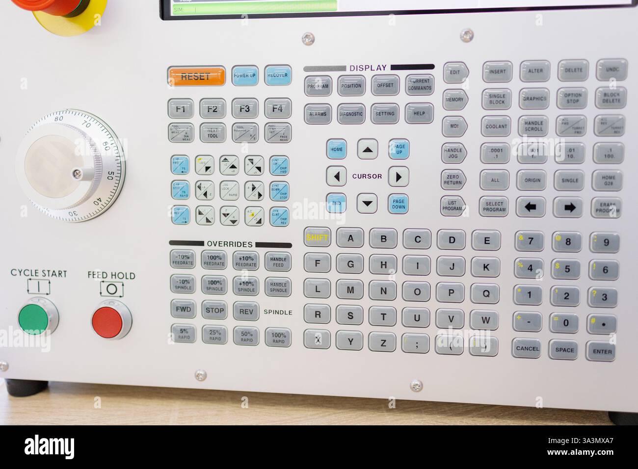 Brightly lit control panel features an array of buttons and dials ...
