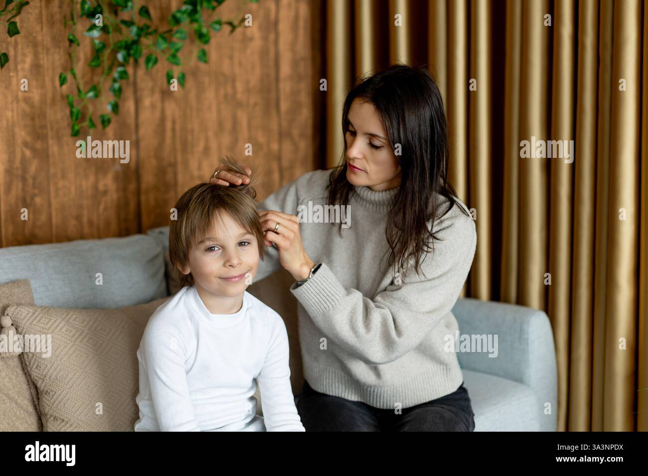 Mother, checking her sons hair for lice, precautions child hair ...
