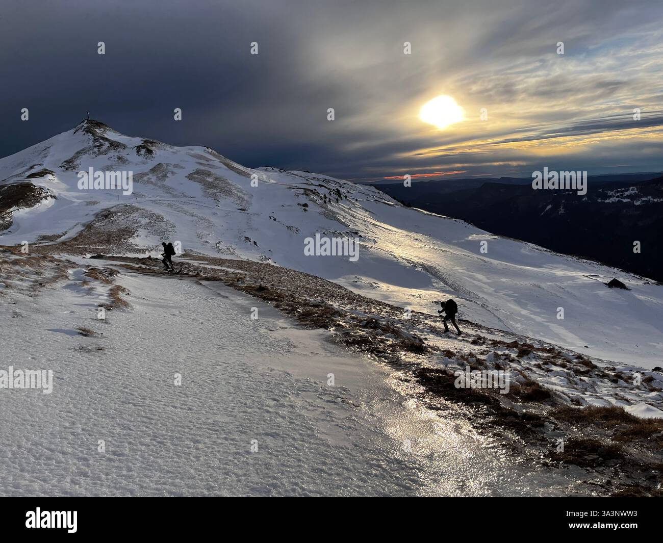 Snowshoeing in the French Jura, at sunset on a splendid ice-covered mountain - Smartphone Captured Stock Image