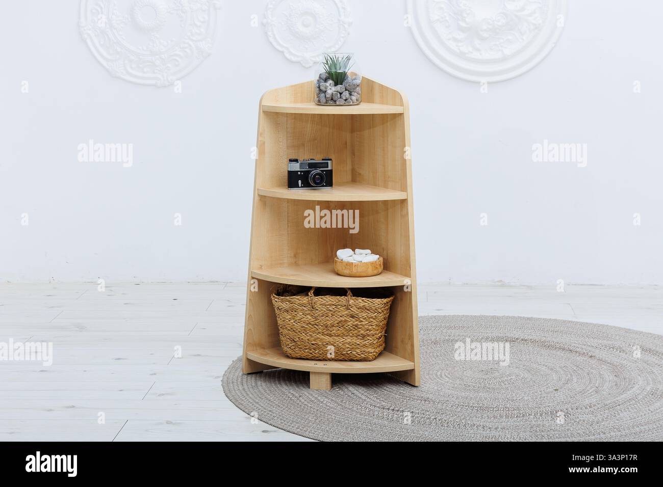 A beautifully crafted wooden shelf that features a stylish basket ...
