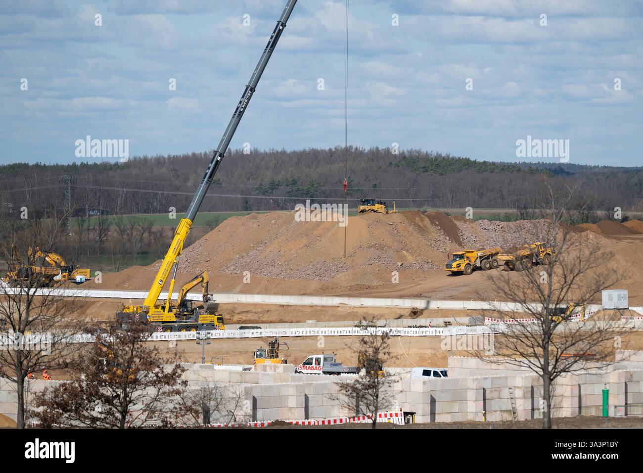 Dresden, Germany. 17th Mar, 2025. Construction vehicles are parked on ...