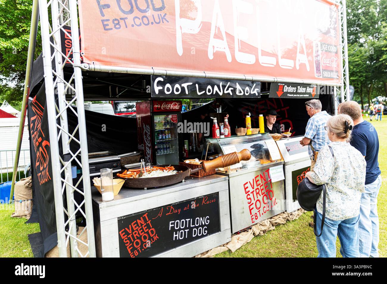 Food stall, outside food stall, Paella food stall, footlong hotdog stall, Lincolnshire Show, Lincoln Showground, Lincoln, Lincolnshire, UK, England Stock Photo