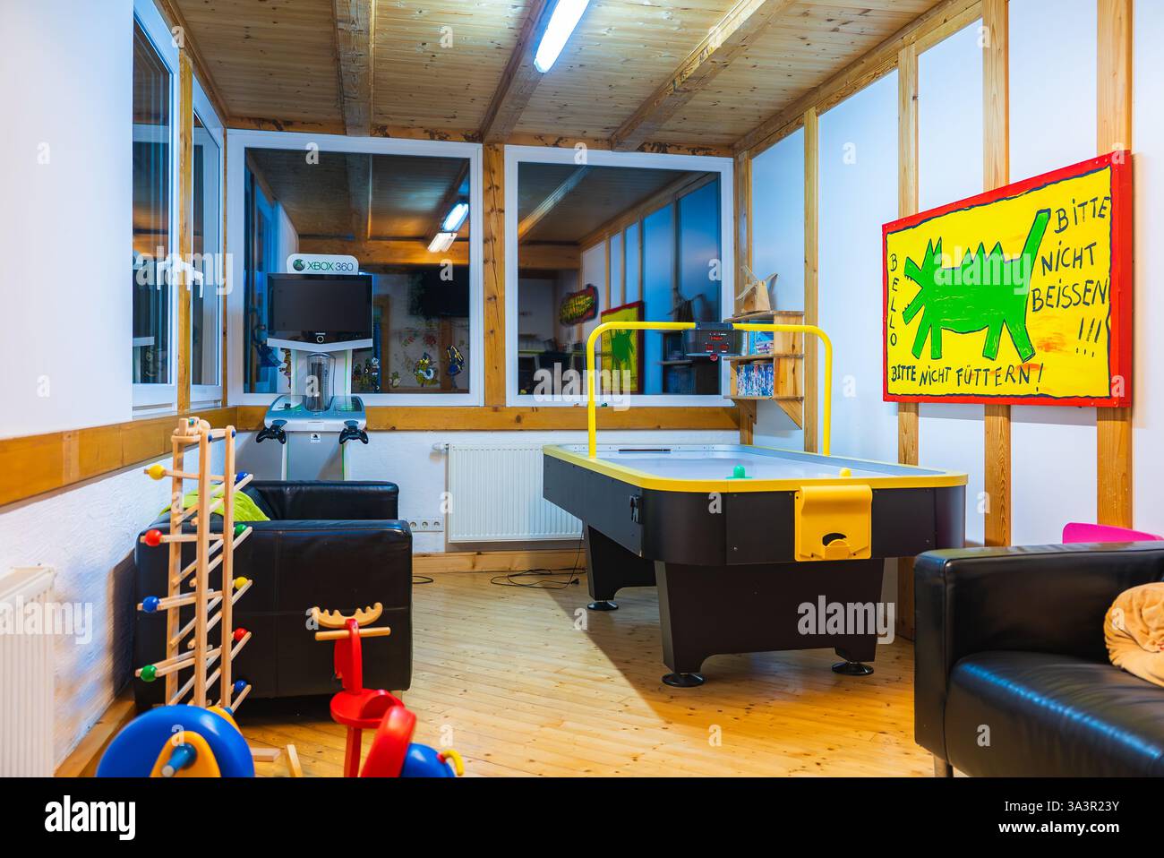 Recreational Room with Air Hockey Table in Mountain Hotel Stock Photo