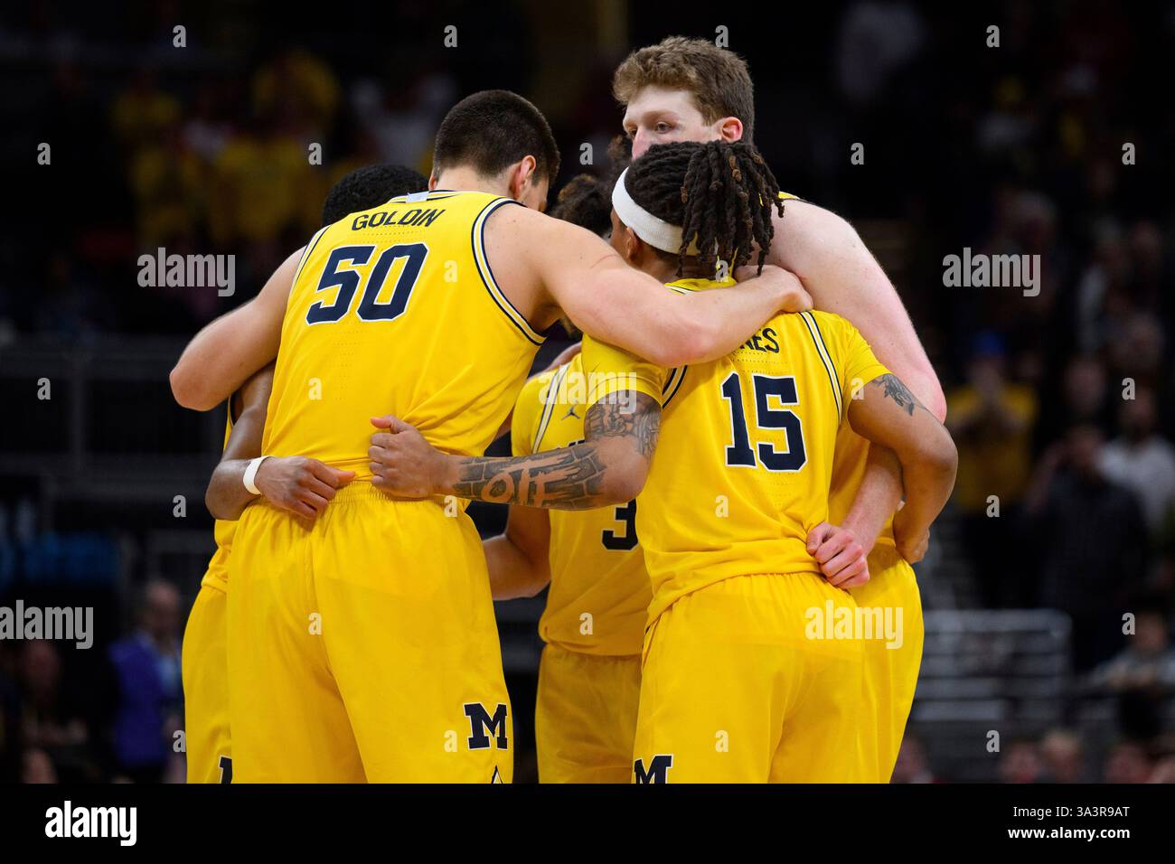 INDIANAPOLIS, IN - MARCH 16: The Michigan Wolverines huddle on the ...