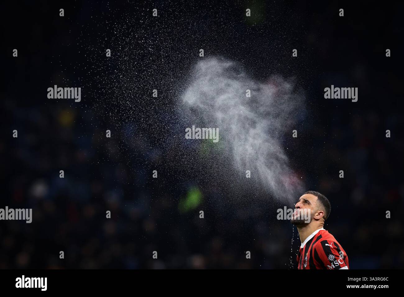 Milan, Italy. 15th Mar, 2025. Kyle Walker of AC Milan spits water prior
