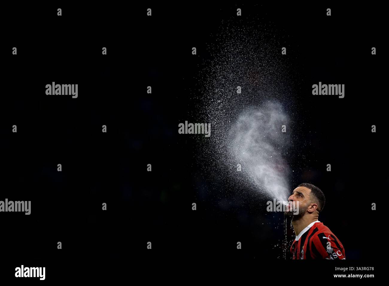 Milan, Italy. 15th Mar, 2025. Kyle Walker of AC Milan spits water prior