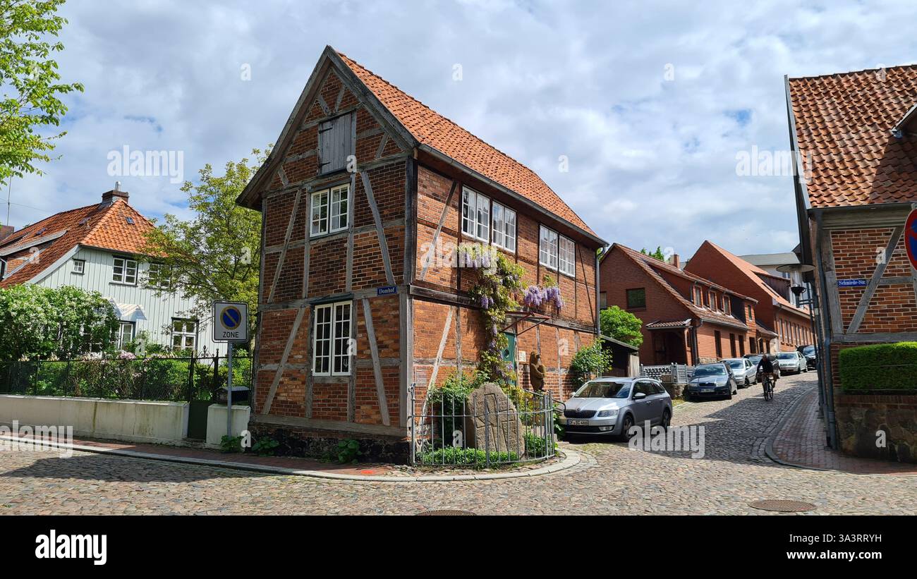 Charming Half-Timbered House on Cobblestone Street in Ratzeburg, Germany - Smartphone Captured Stock Image Charming Half-Timbered House on Cobblestone Street in Ratzeburg, Germany - Smartphone Captured Stock Image