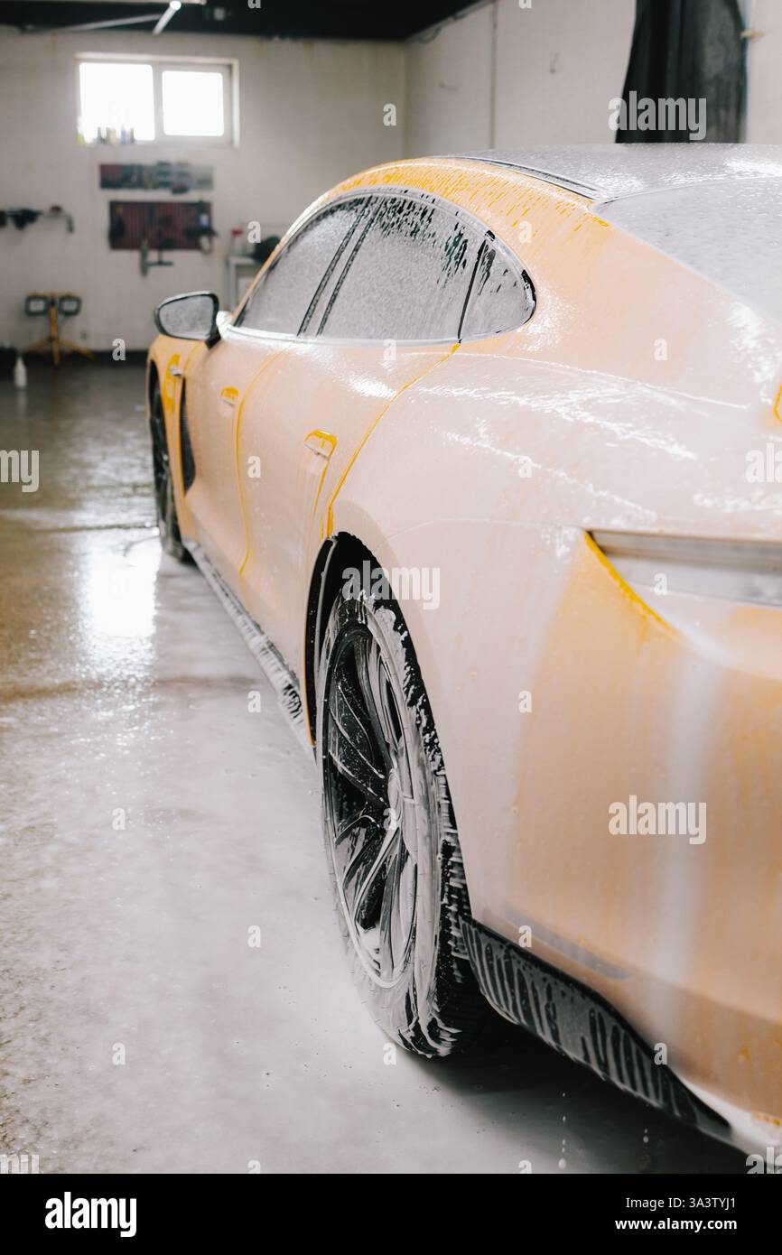 Process Of Washing Car With Soap Solution During Meticulous Car process-of-washing-car-with-soap-solution-during-meticulous-car