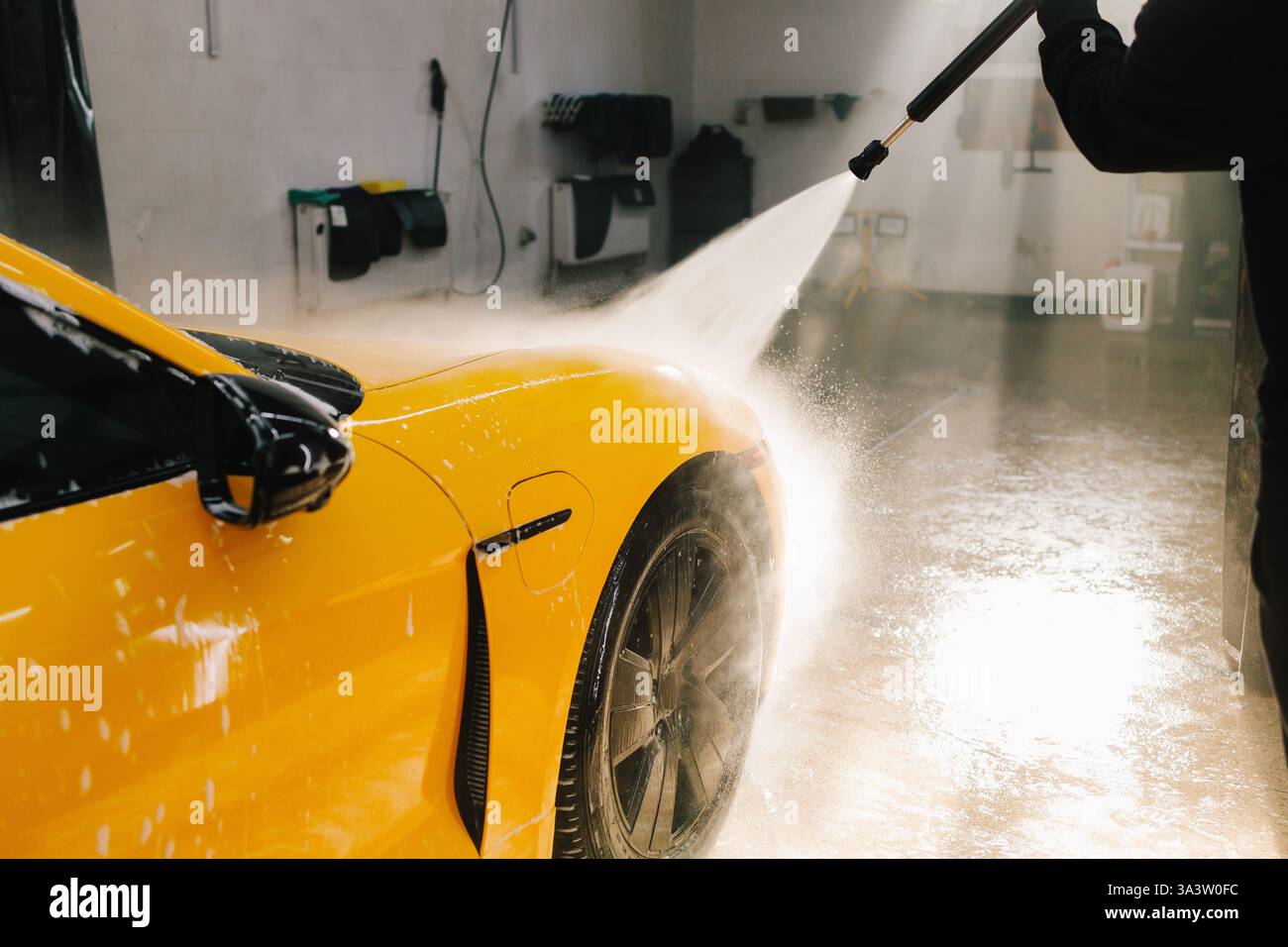 Detailing Process Of Washing Car From Water Gun At The Car Wash detailing-process-of-washing-car-from-water-gun-at-the-car-wash