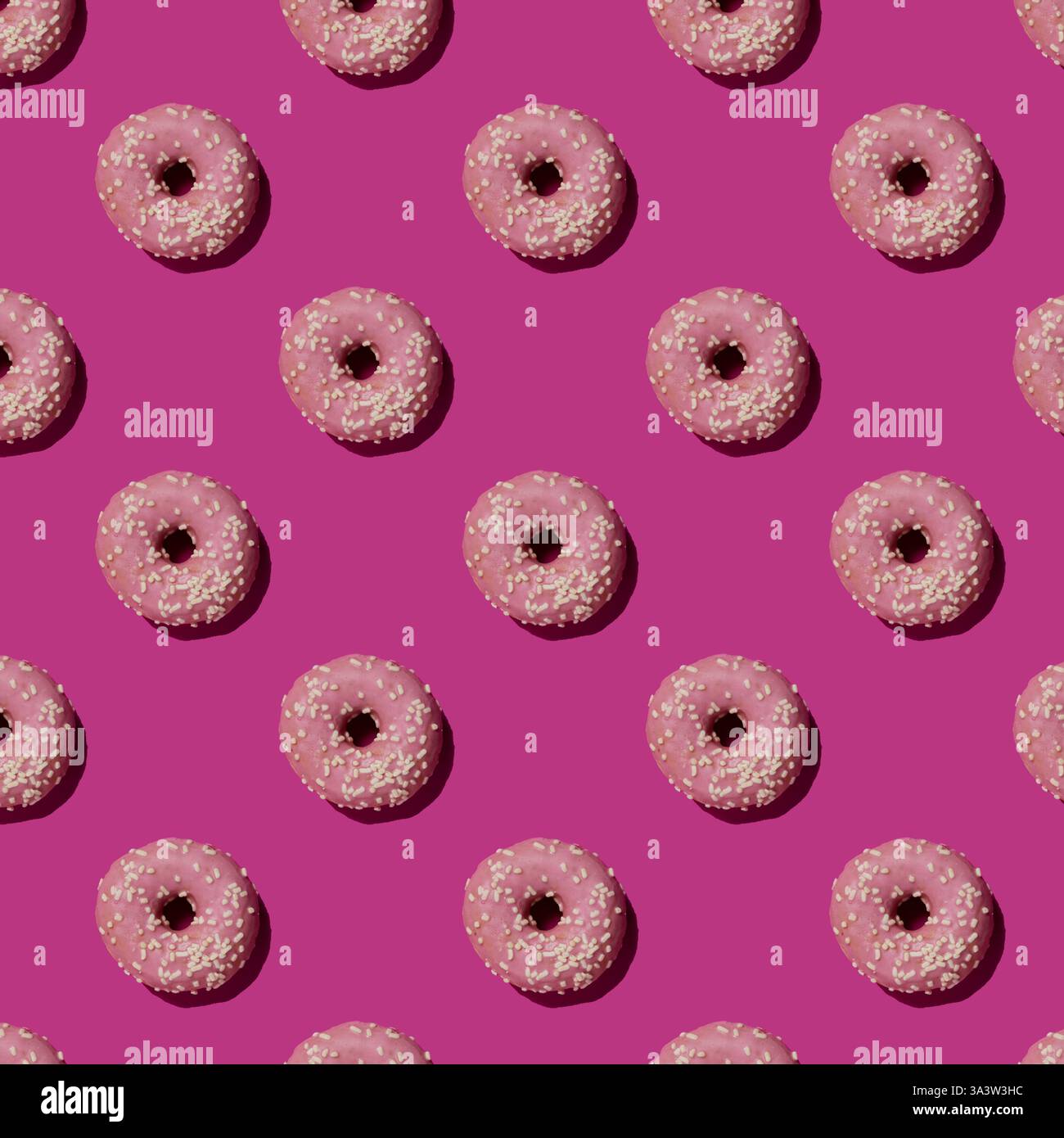 Pattern with pink donuts on the violet background Stock Photo