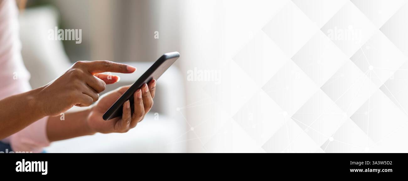 Focused black lady using a digital tablet Stock Photo