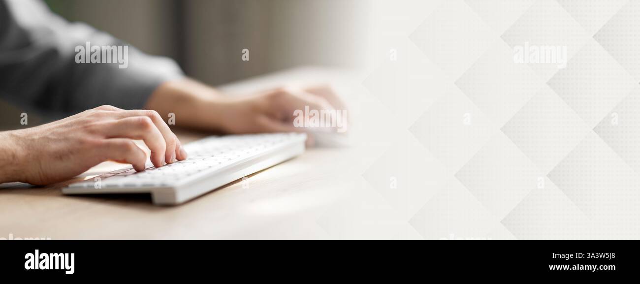 Unrecognizable Man Typing On Computer Keyboard And Using Wireless Mouse Stock Photo