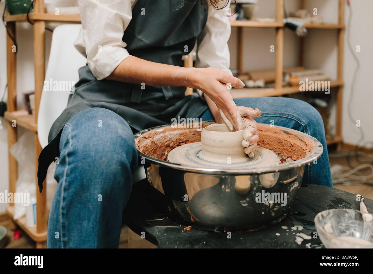 Process of making a unique ceramic shape. Potter creates a ceramic bowl ...