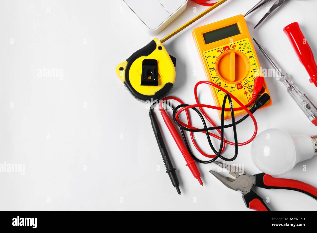 Different electrical tools on light background, flat lay. Space for text Stock Photo