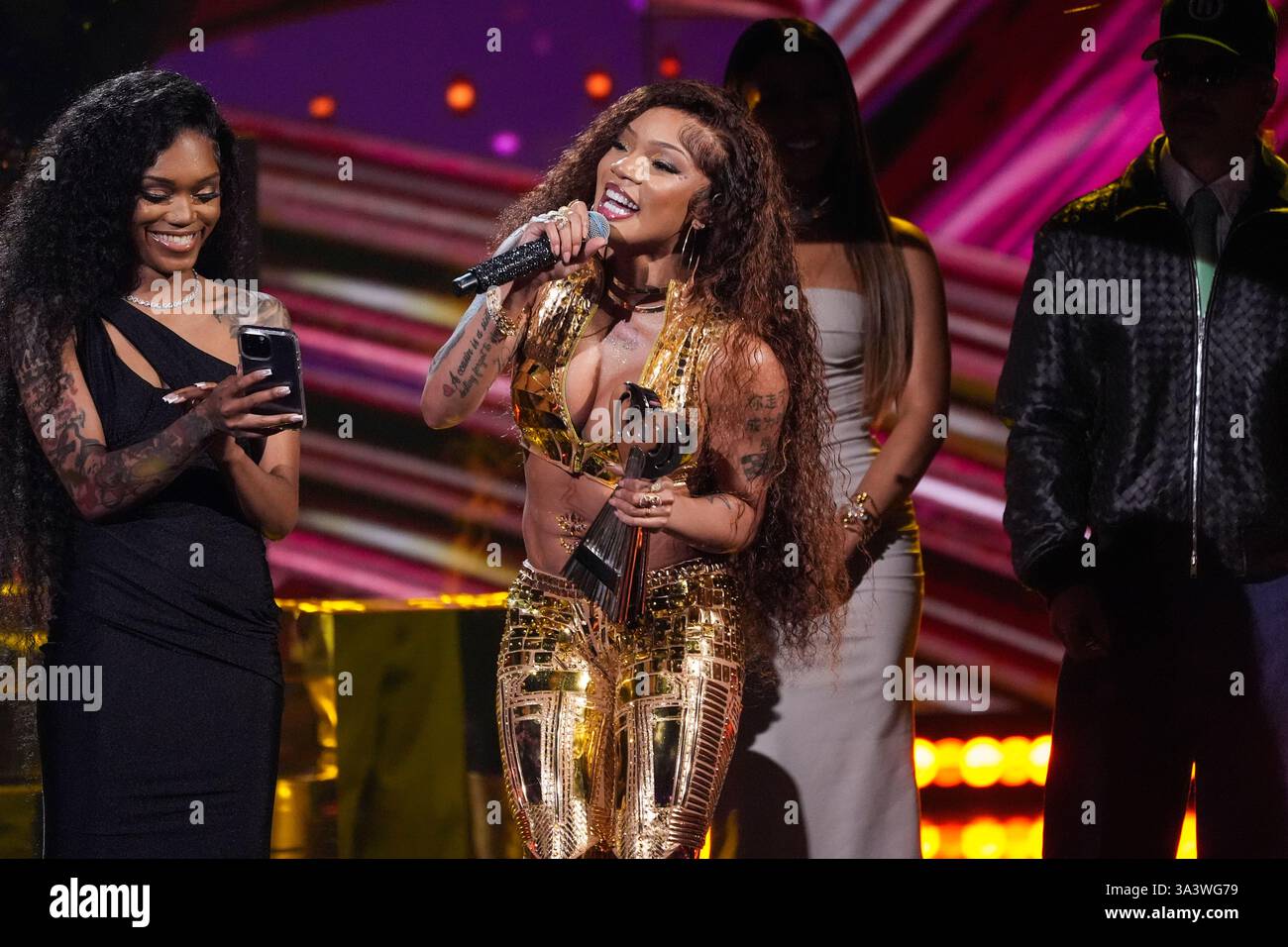 GloRilla accepts the award for hip-hop artist of the year during the ...