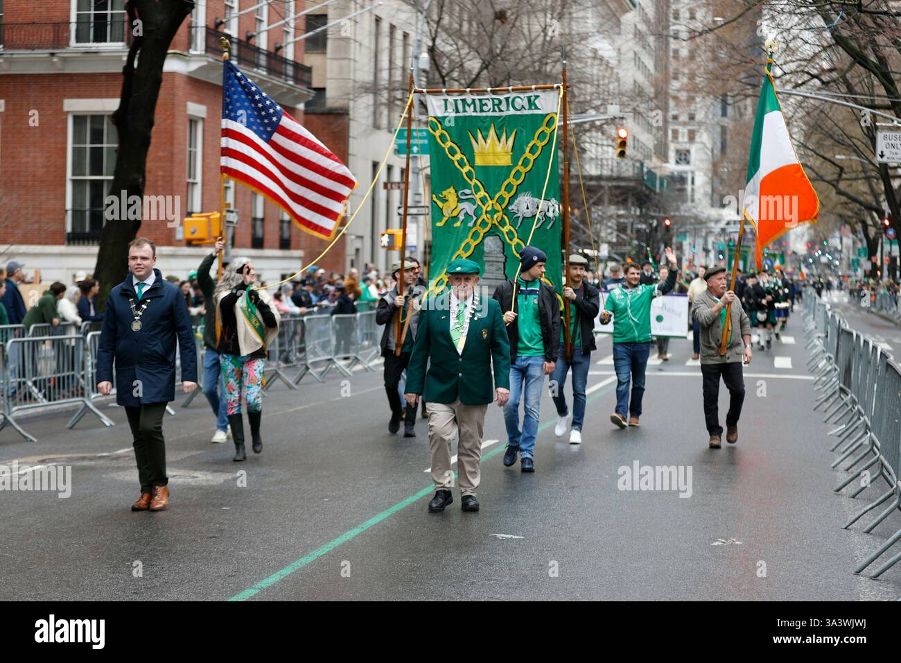 NEW YORK, NEW YORK - MARCH 17, 2025: Crowds gather along 5th Avenue to ...