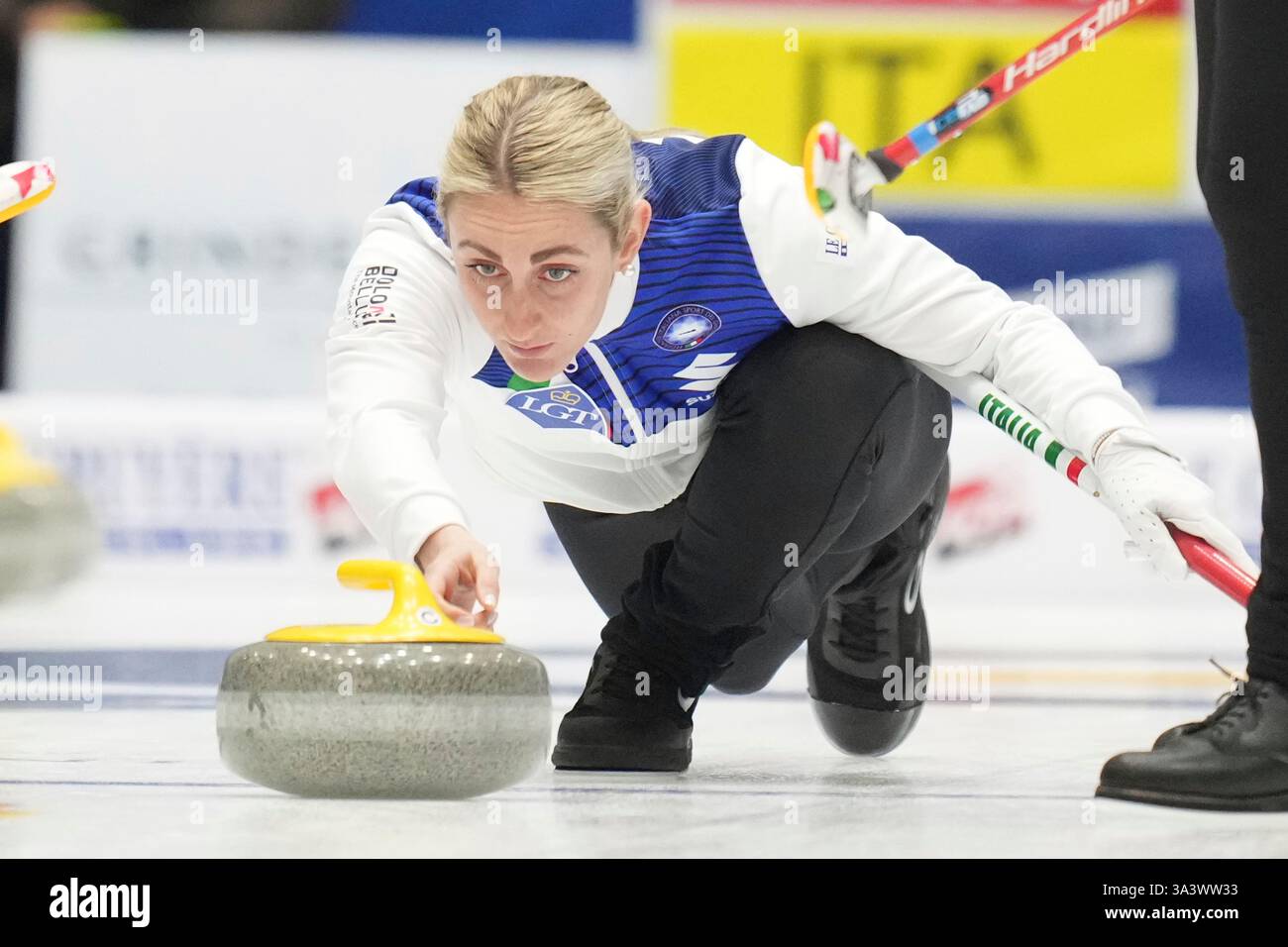 Italy's Elena Mathis releases the stone during the match against China ...