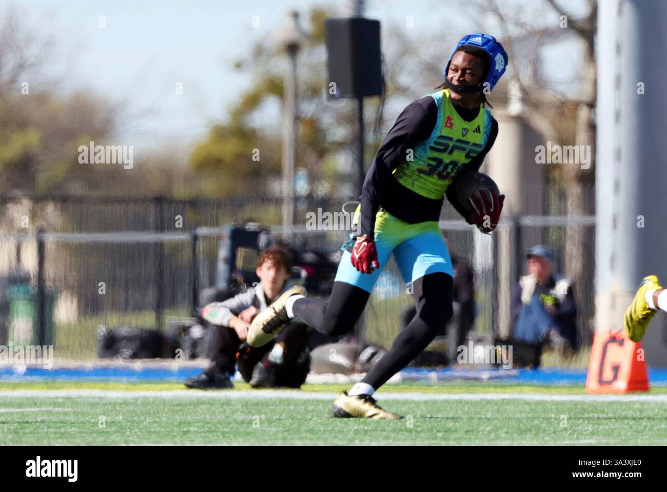 Tedarius SFE safety Tedarius Hughes (305) carries the ball after an interception ...