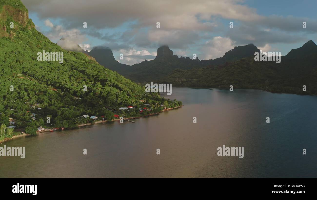 Golden Hour Bathes The Tranquil Ocean Bay Of Moorea French Polynesia 