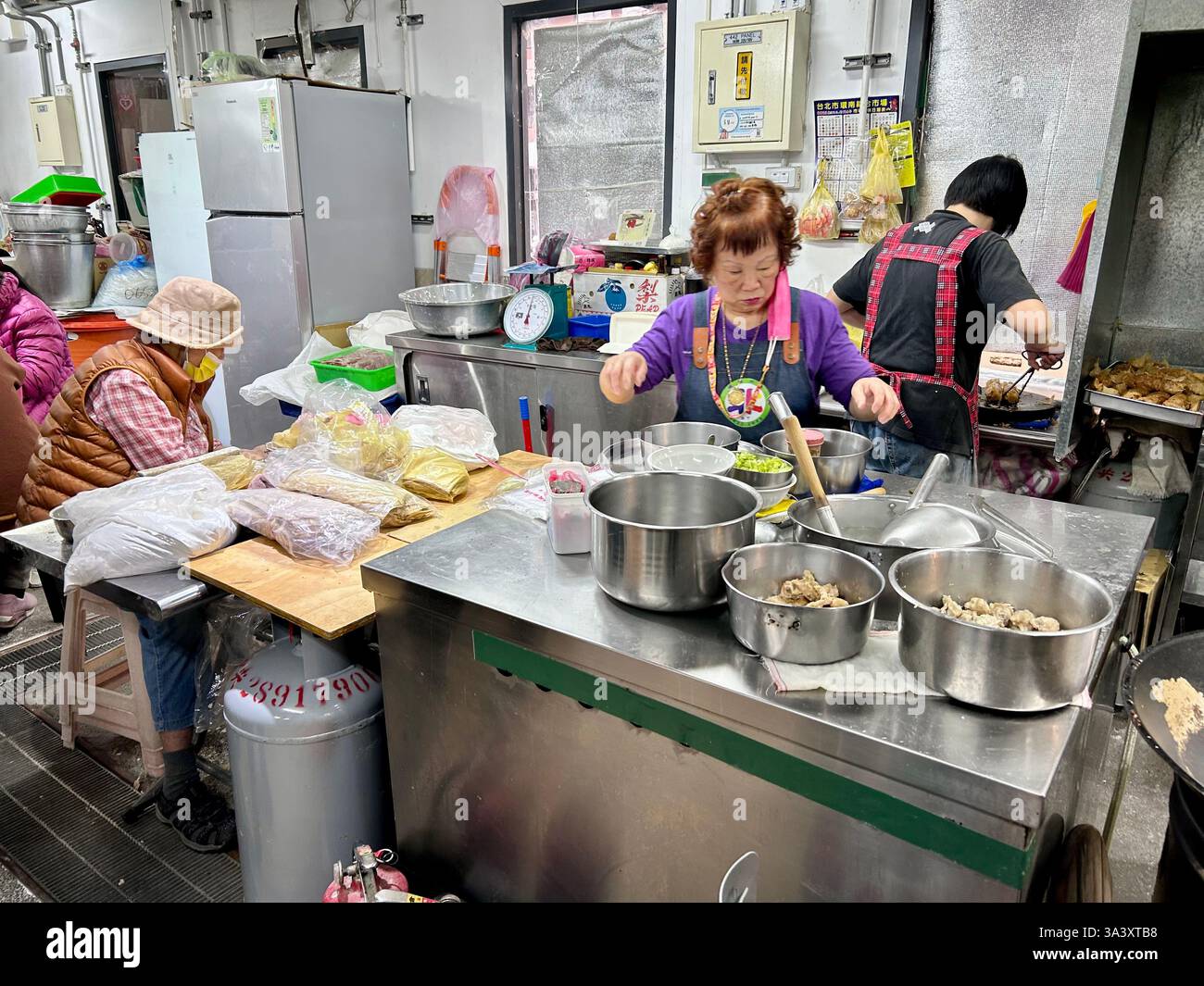 Taipei, Taiwan, People, Women in Kitchen, inside local Food Market, Beitou District, (Qingjiang), senior working active woman 50 years old - Smartphone Captured Stock Image