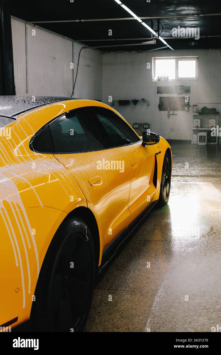 Sports Car During Detailing Wash With Soap Foam At The Auto Service sports-car-during-detailing-wash-with-soap-foam-at-the-auto-service