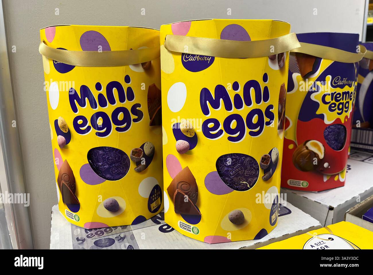 Two Cadbury Mini Eggs Easter Eggs on a Tesco Supermarket Shelf. Swansea, Wales, United Kingdom. 13th March 2025. - Smartphone Captured Stock Image