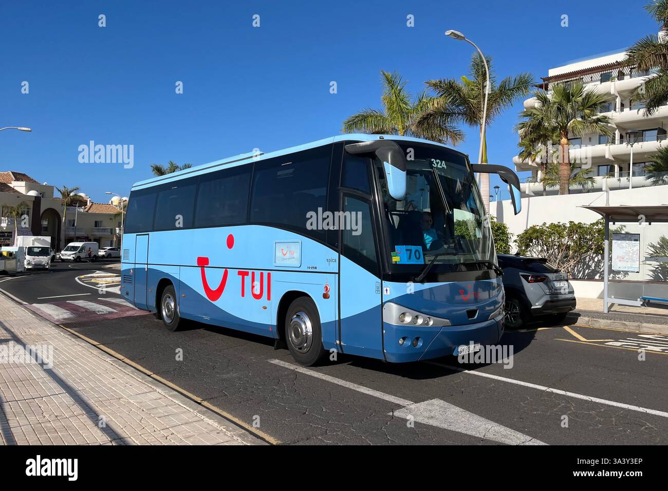 TUI Transfer Bus driving through Playa Paraiso. Adeje, Tenerife, Canary Islands, Spain. 31st January 2025. - Smartphone Captured Stock Image
