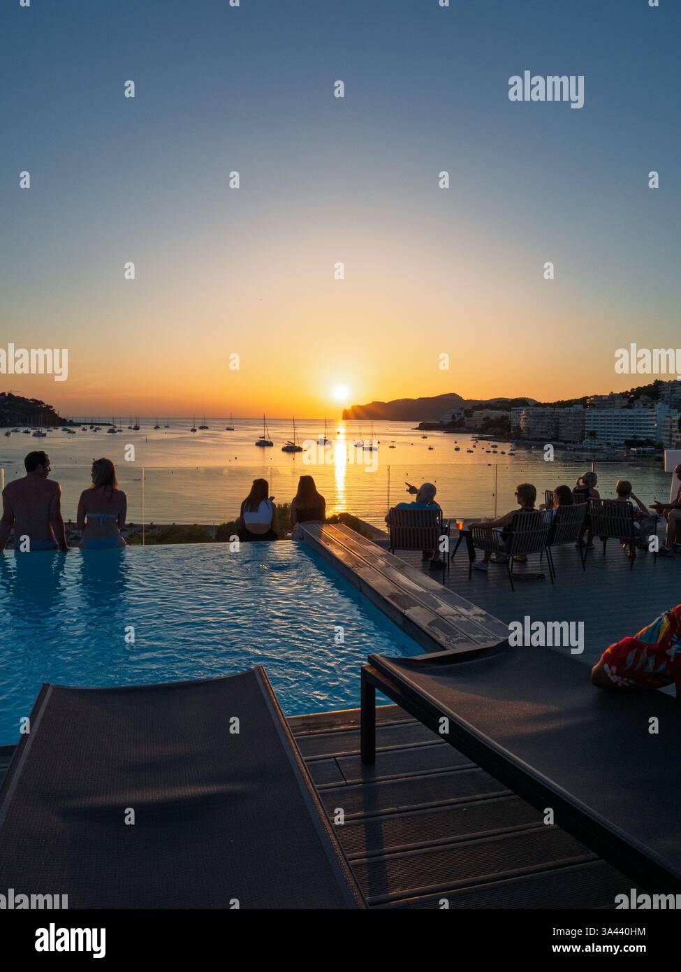 Watching mediterranean sunset from rooftop Stock Photo