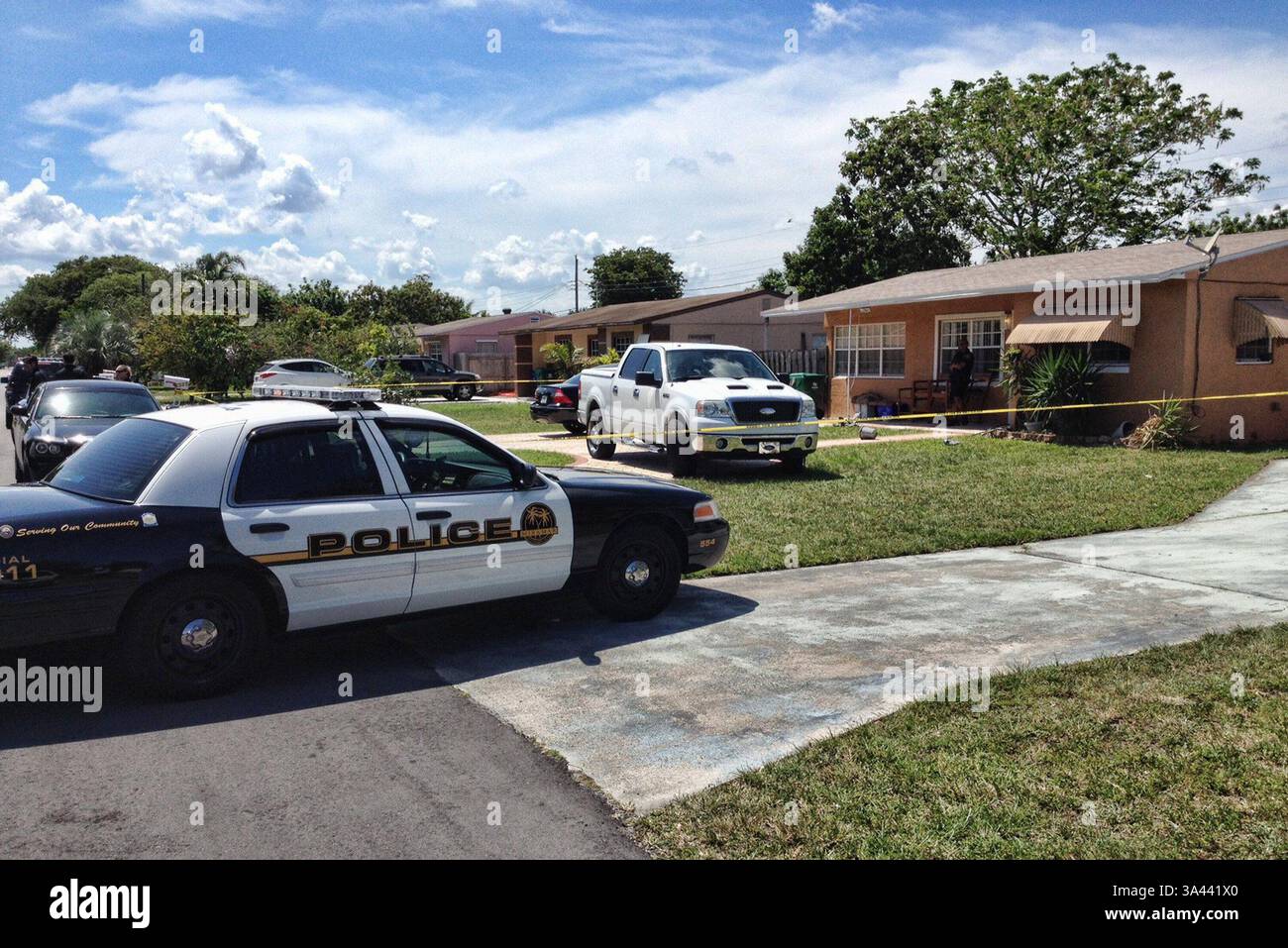 Apr 28, 2014 - Miramar, Florida, U.S. - Police at home of an apparent murder-suicide of a married couple whose bodies were found by their daughter. Katrina Manseau went to check on her parents around noon Monday at a house she owned in the 6500 block of Southwest 19th Street, where her parents had been living for about two weeks. She found father William Manseau, 57, and mother Kathleen Manseau, 61, dead inside, said Miramar Police spokeswoman Tania Rues. Katrina Manseau had driven up the white Ford pickup truck. Minutes later, police arrived and she came out of the house upset, with her hands Stock Photo