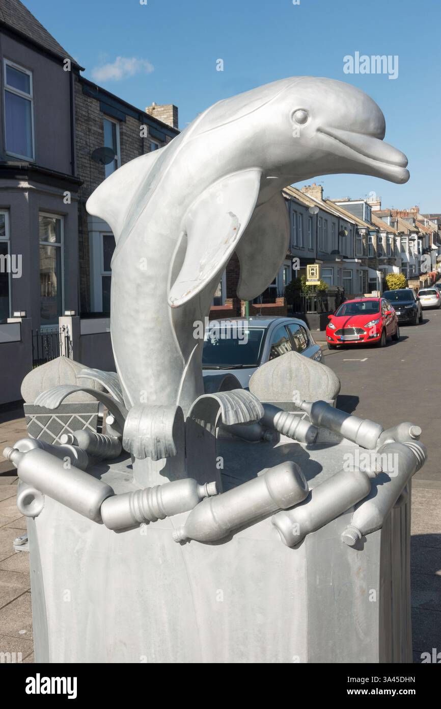 A waste bin featuring a dolphin surrounded by plastic bottles, reducing ...