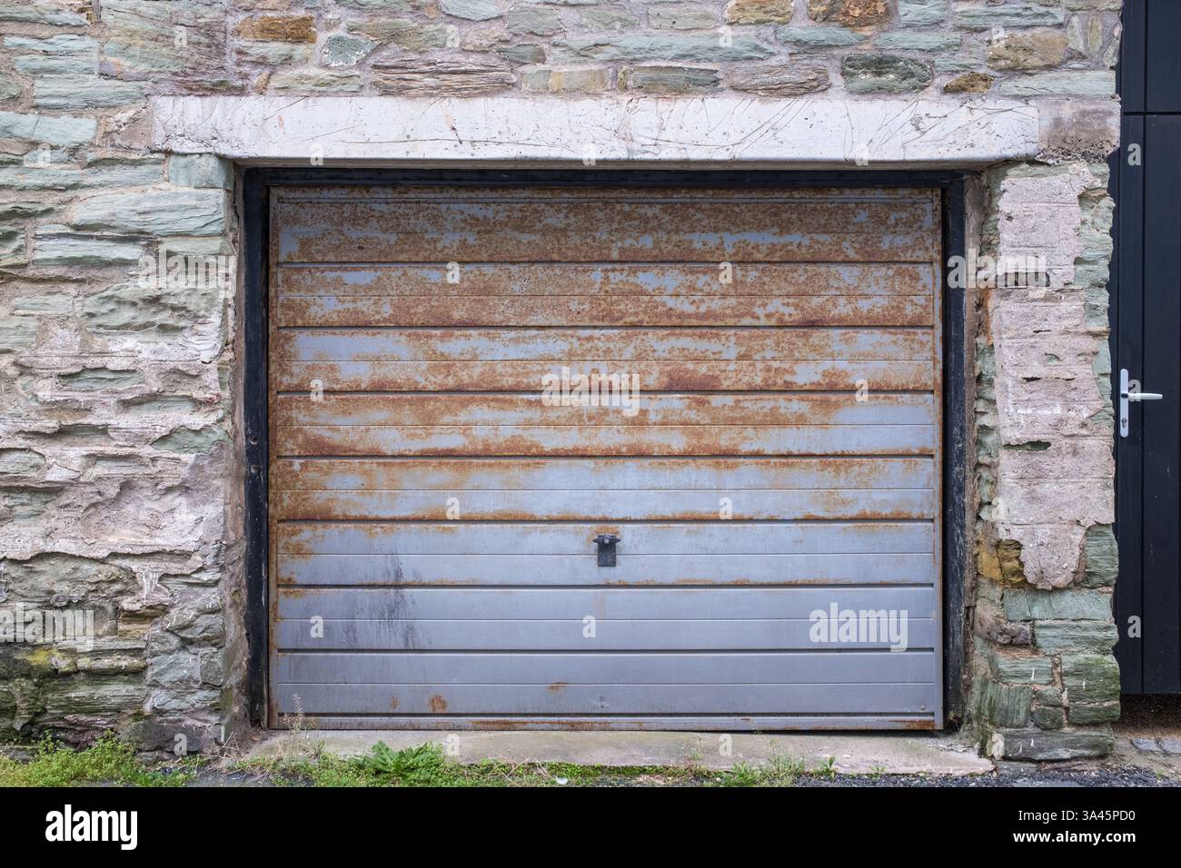 Rusted grey garage door Stock Photo
