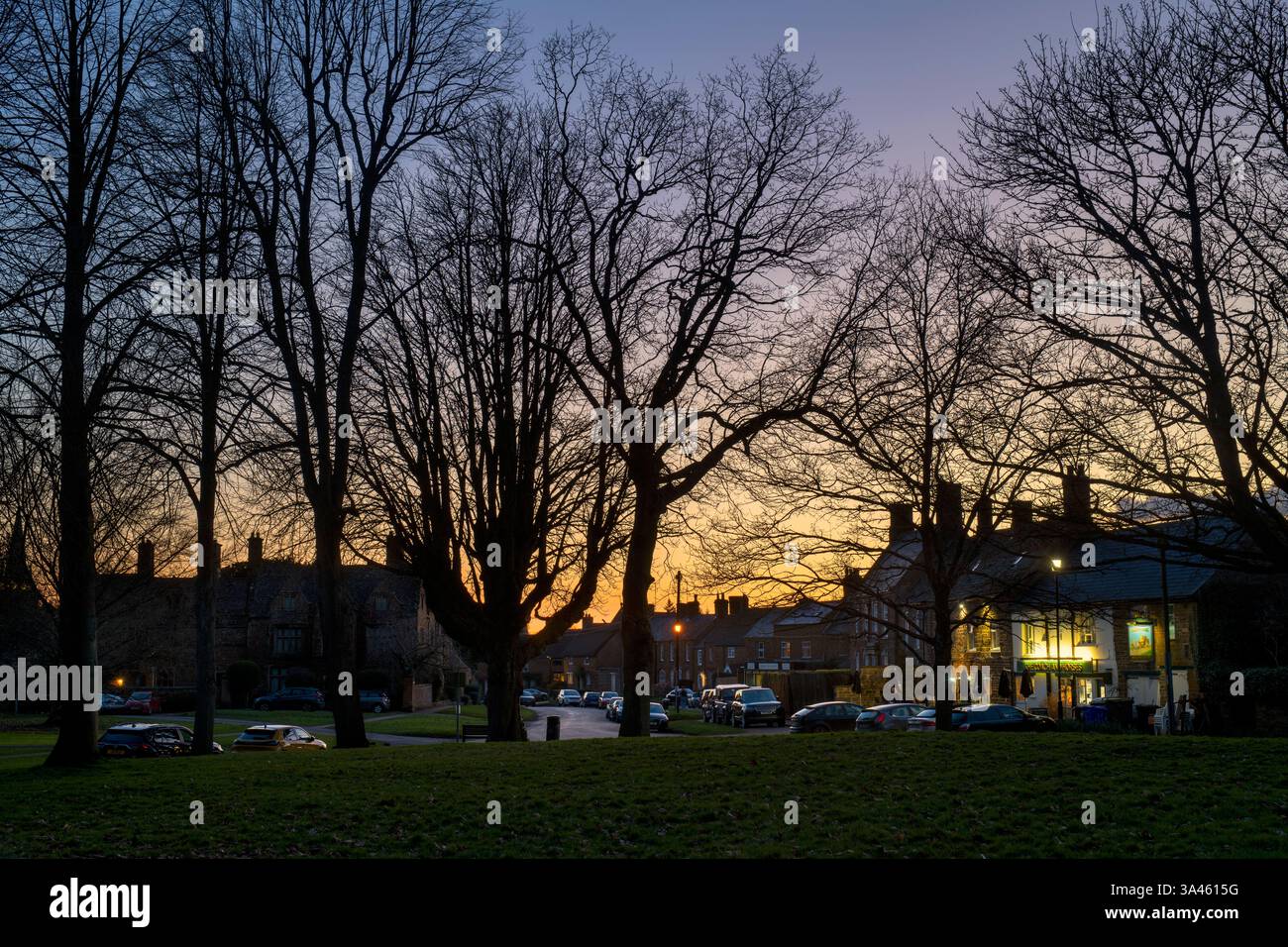 Adderbury view from the green after sunset. Oxfordshire, England Stock Photo