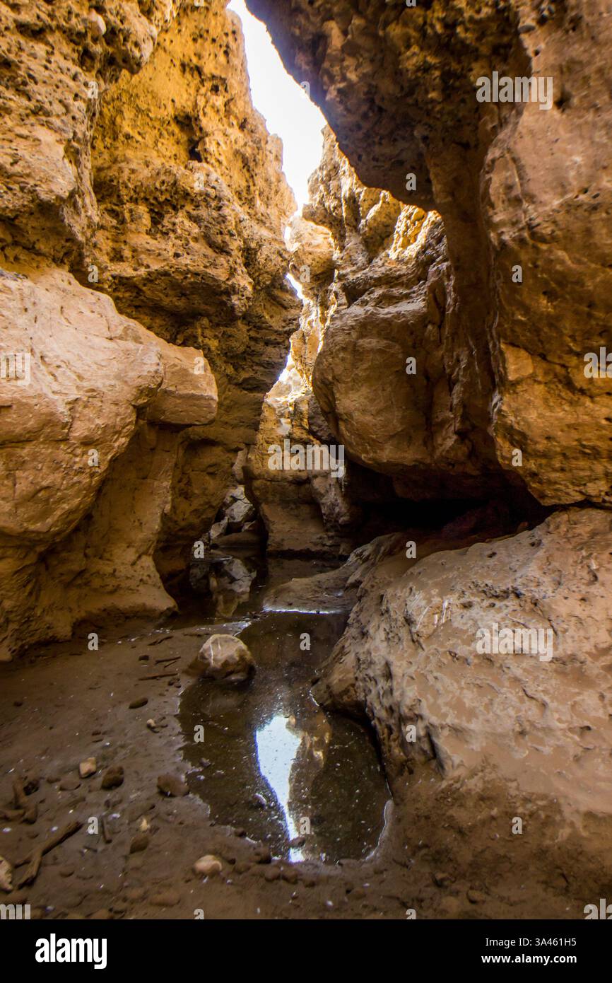 Namibia Cliffs Water at the base of the Sesriem Canyon in Namibia, reflecting the high ...
