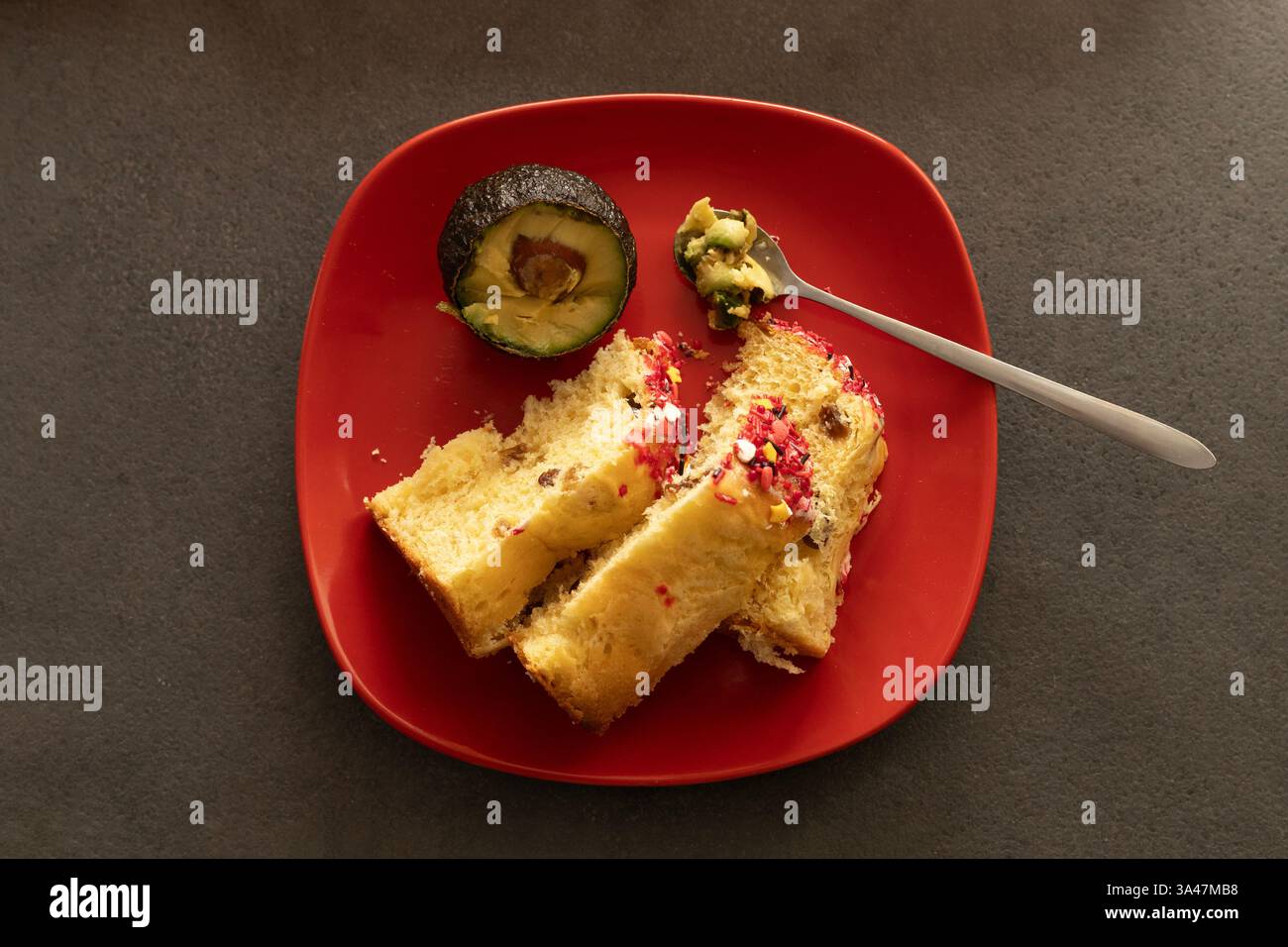 Two Easter cakes and avocado on a red plat Stock Photo