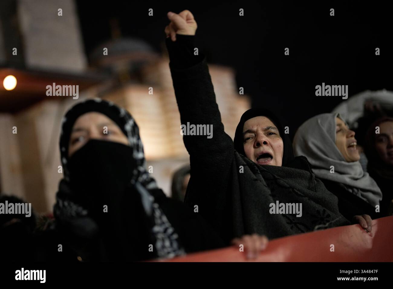 People shout slogans during a pro-Palestinian protest outside Fatih ...