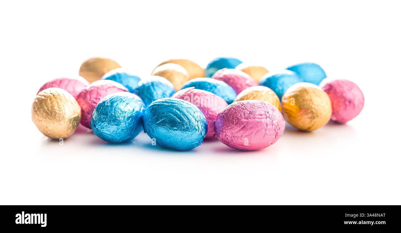 Chocolate easter eggs wrapped in multi colored foil isolated on a white background. Stock Photo